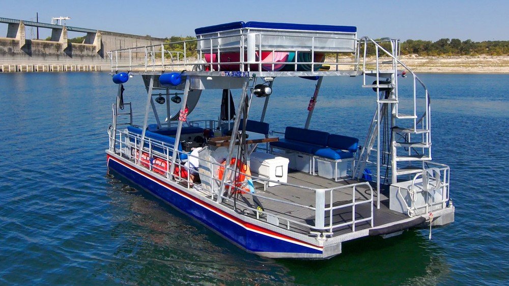 Luxury boat rental on Lake Travis with clear skies