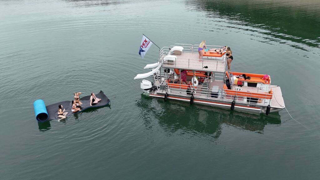 Group enjoying a boat ride on Austin's Lake