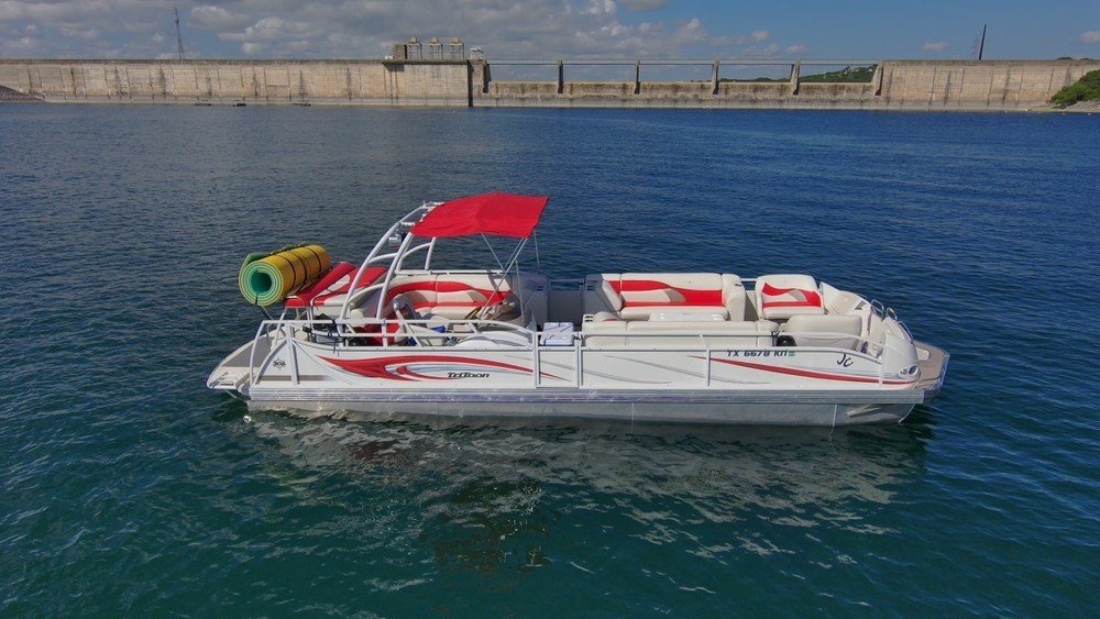 Red boat on Lake Travis for an exclusive rental experience